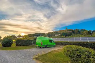 Electric hardstanding pitches with views of the Glastonbury Tor