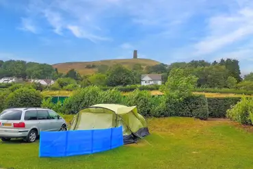Non electric grass tent pitches with views of the Glastonbury Tor