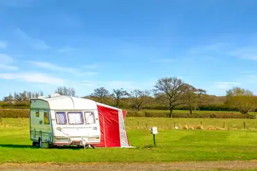 Grass pitches with space for an awning at Weston Caravan and Campsite