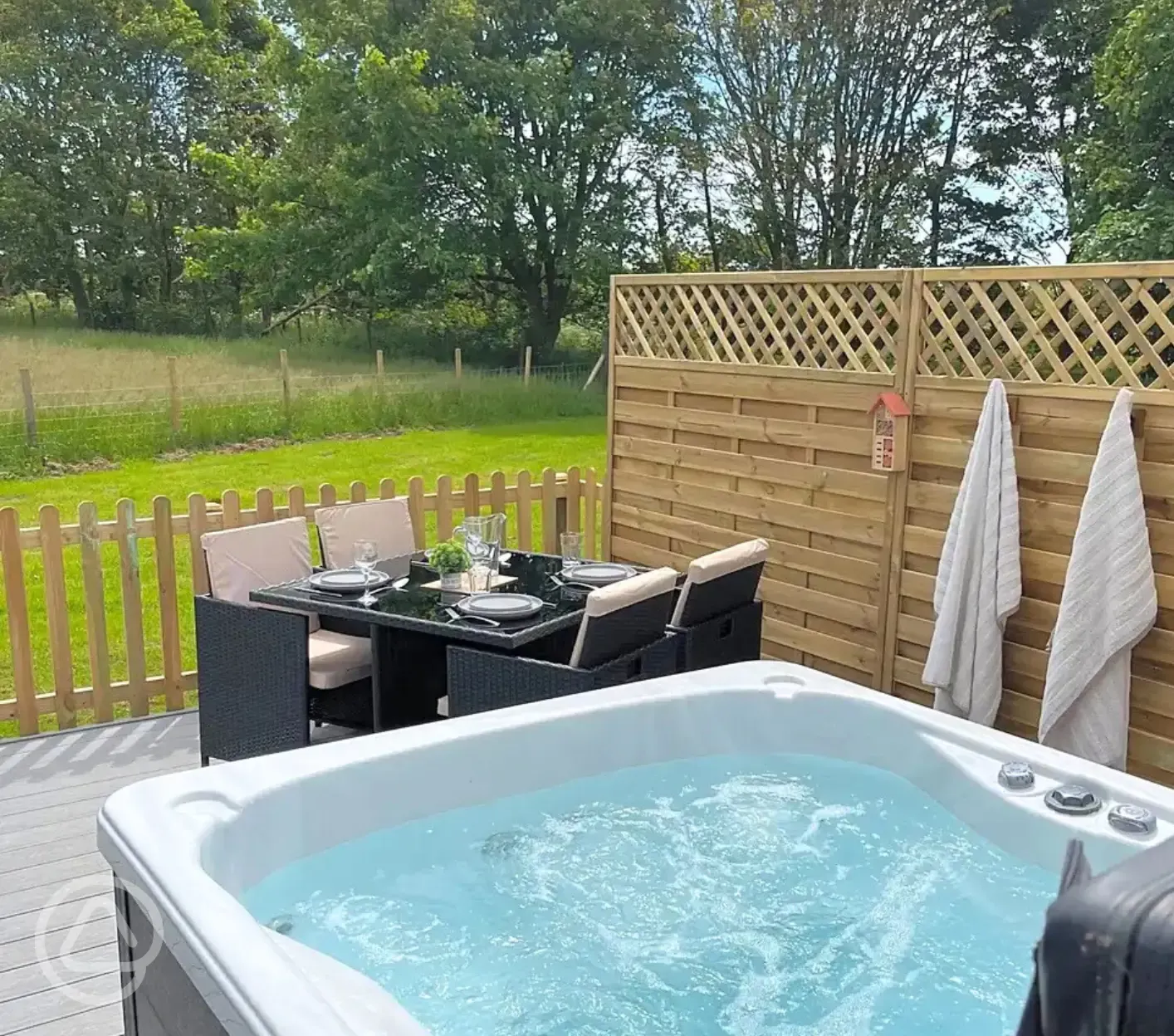 Ensuite glamping pod with a fenced-off private decked area and a hot tub