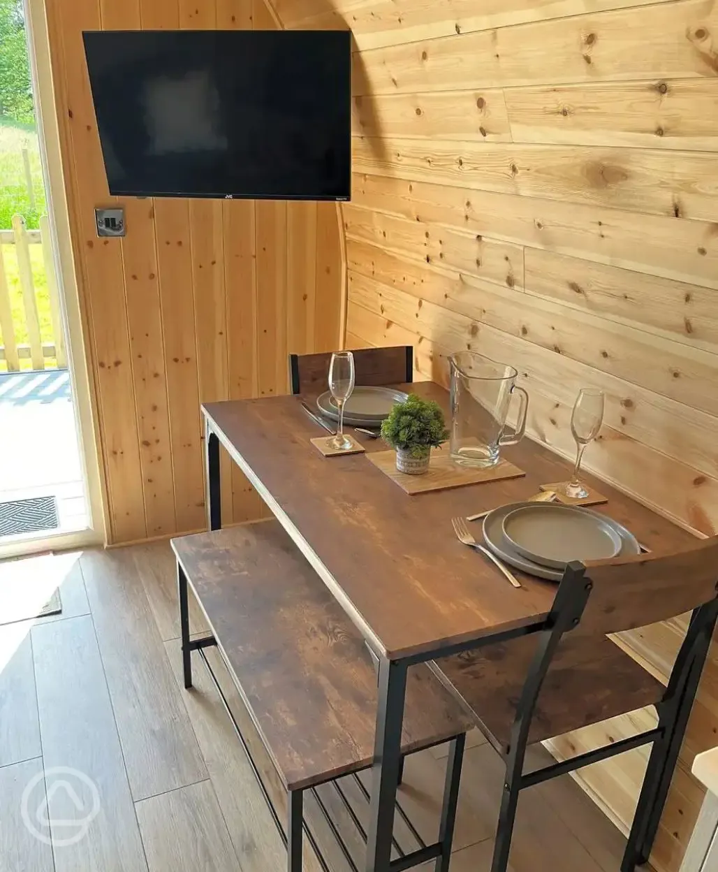 Ensuite glamping pod dining area and TV