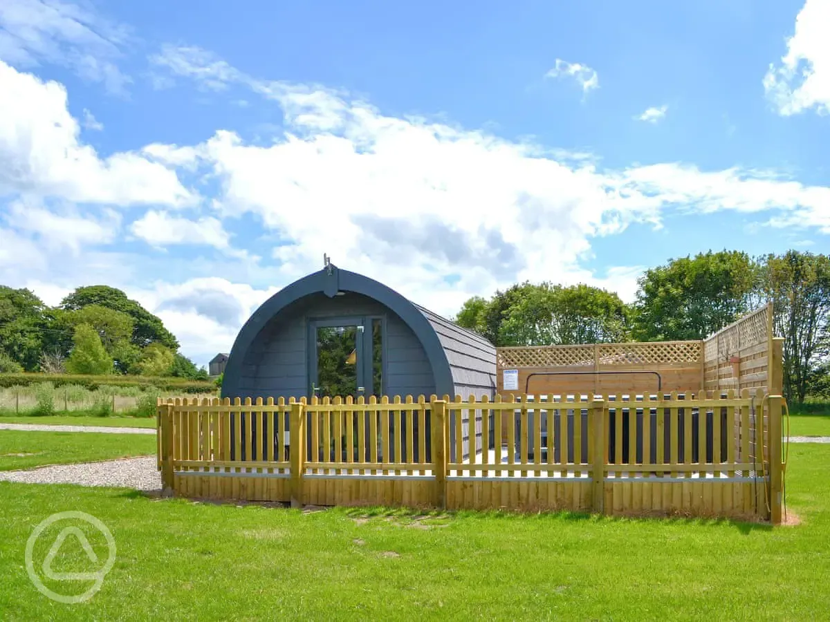 Ensuite glamping pod with a fenced-off private decked area and a hot tub