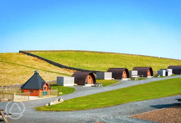 View to glamping pods with hot tubs and BBQ hut (for hire)