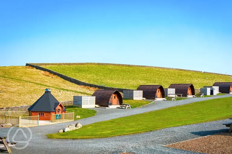 View to glamping pods with hot tubs and BBQ hut (for hire)