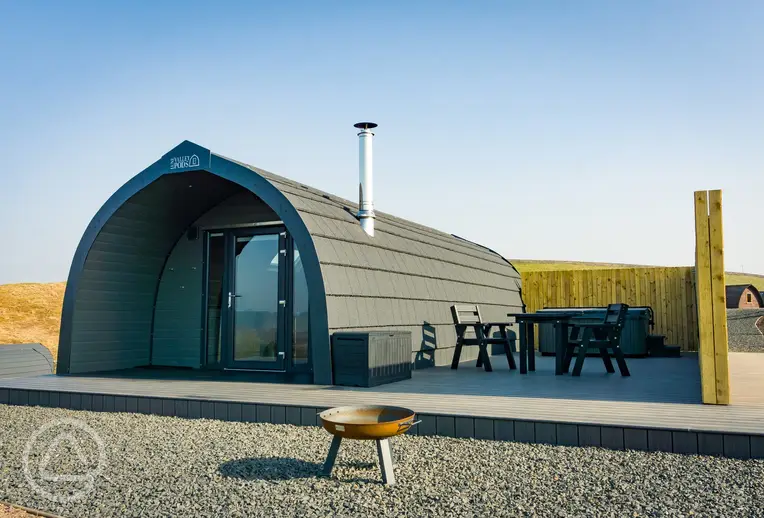 Castle glamping pod with a private hot tub and patio