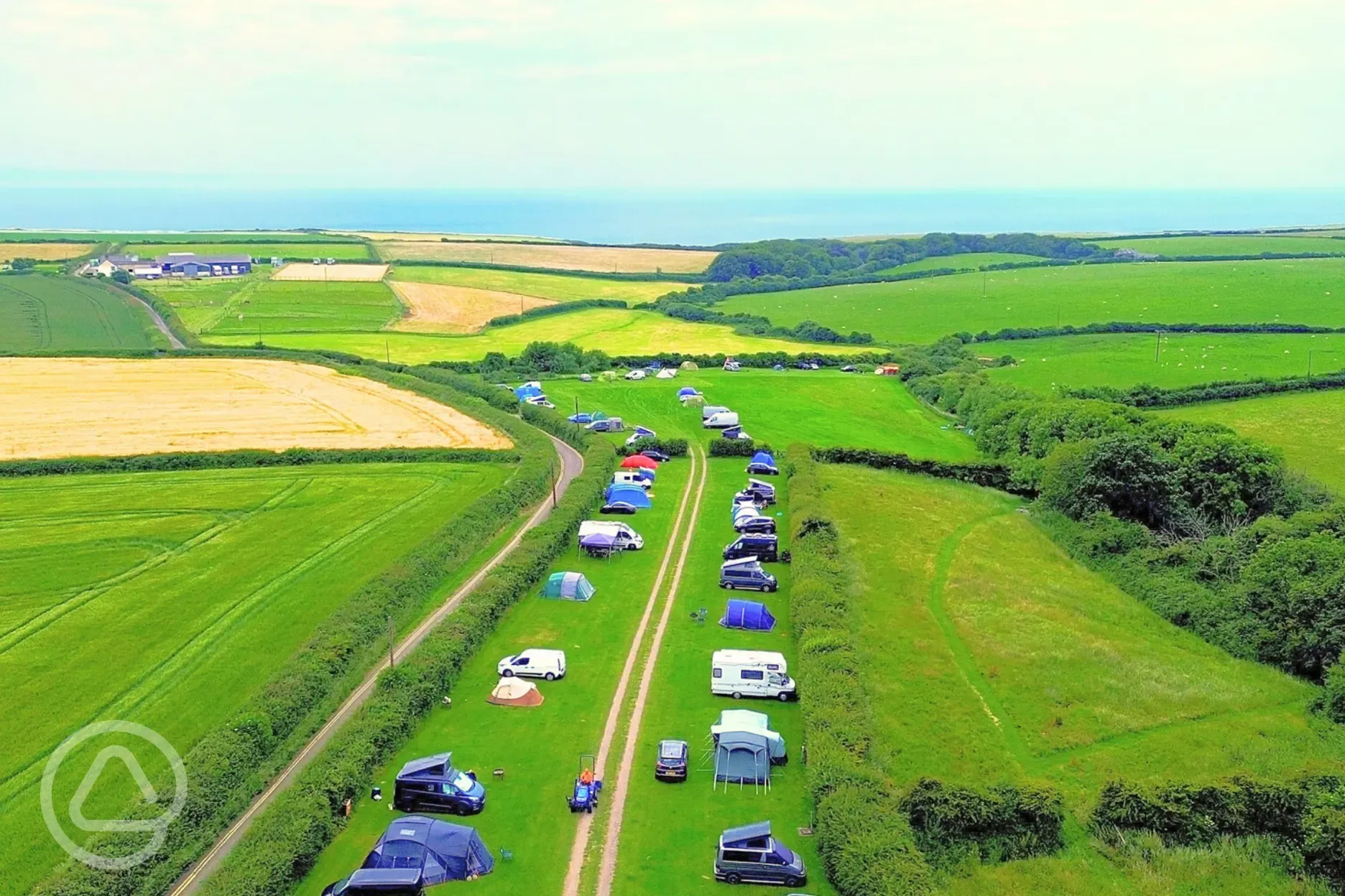 Aerial view of pitches Heritage Coast Campsite with views to Monknash Beach