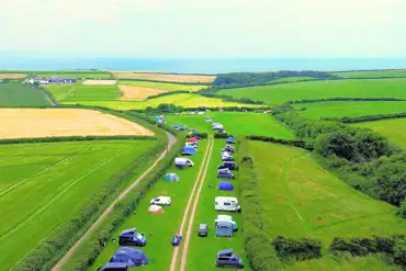 Aerial view of pitches Heritage Coast Campsite with views to Monknash Beach