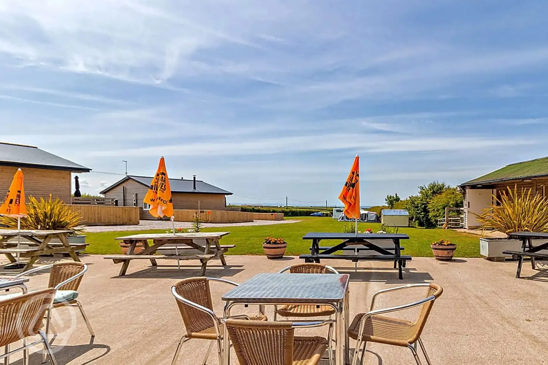 Club house outdoor seating with umbrellas