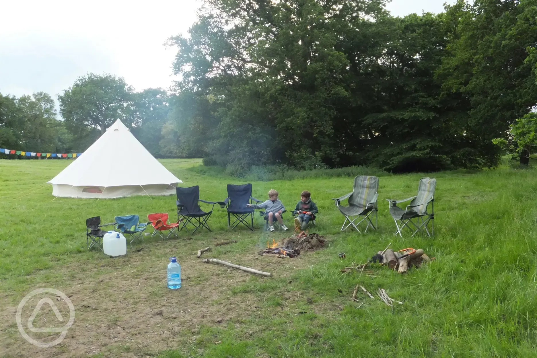 Guests sitting around the campfire