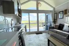 Hill top lodge interior with a double sofa bed and kitchen