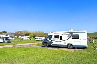Electric hardstanding and grass pitches at Higher Moor Farm Campsite