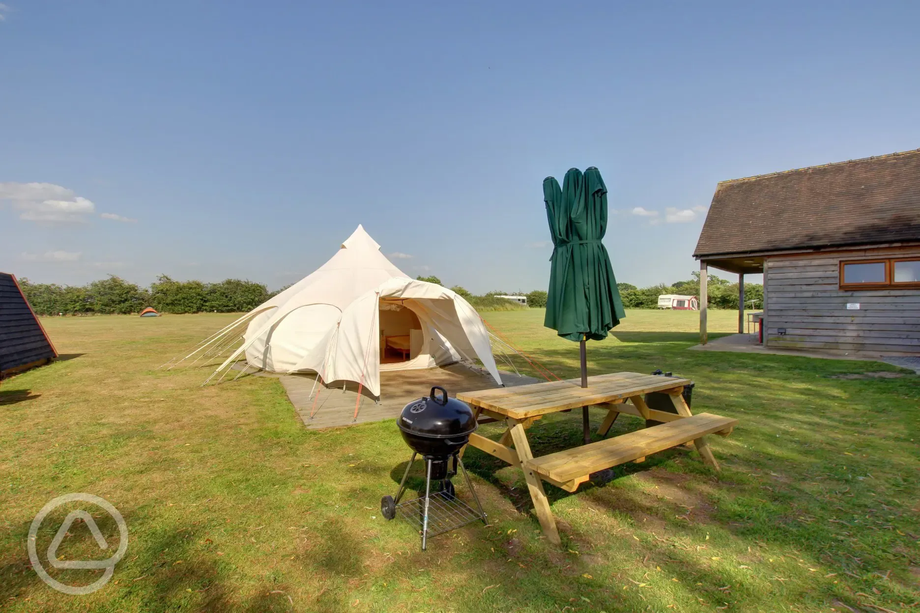 Lotus Belle Tent with outdoor seating, parasol and BBQ