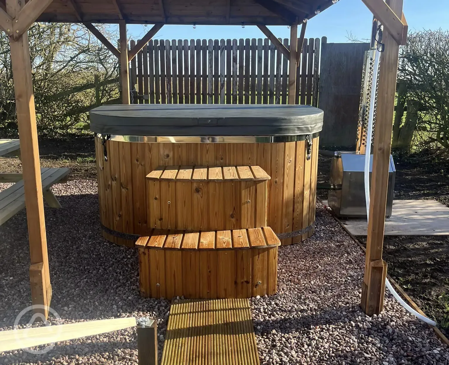 Plus Deluxe Lotus Belle Tent with round hot tub under gazebo