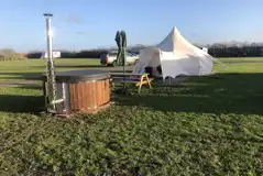 Deluxe Lotus Belle Tent exterior with Hot Tub Deluxe Lotus Belle Tent exterior with Hot Tub