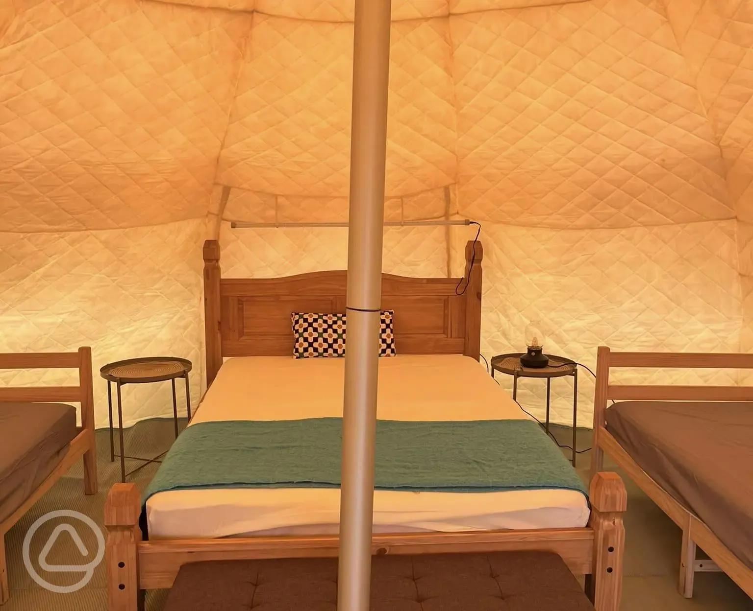 Plus Lotus Belle Tent interior with double bed and four single beds