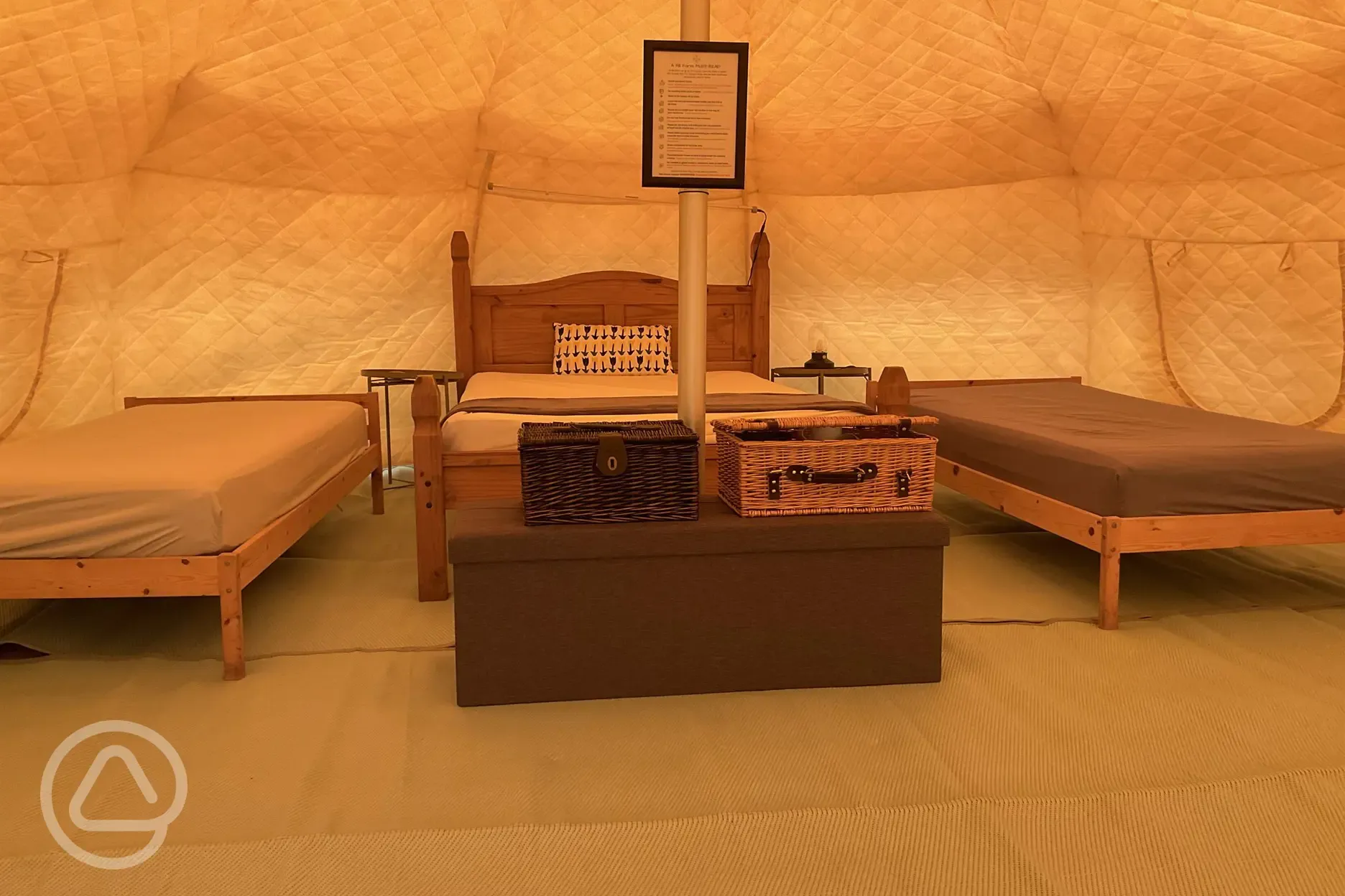 Lotus Belle Tent interior with a double bed and two single beds