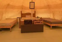 Lotus Belle Tent interior with a double bed and two single beds