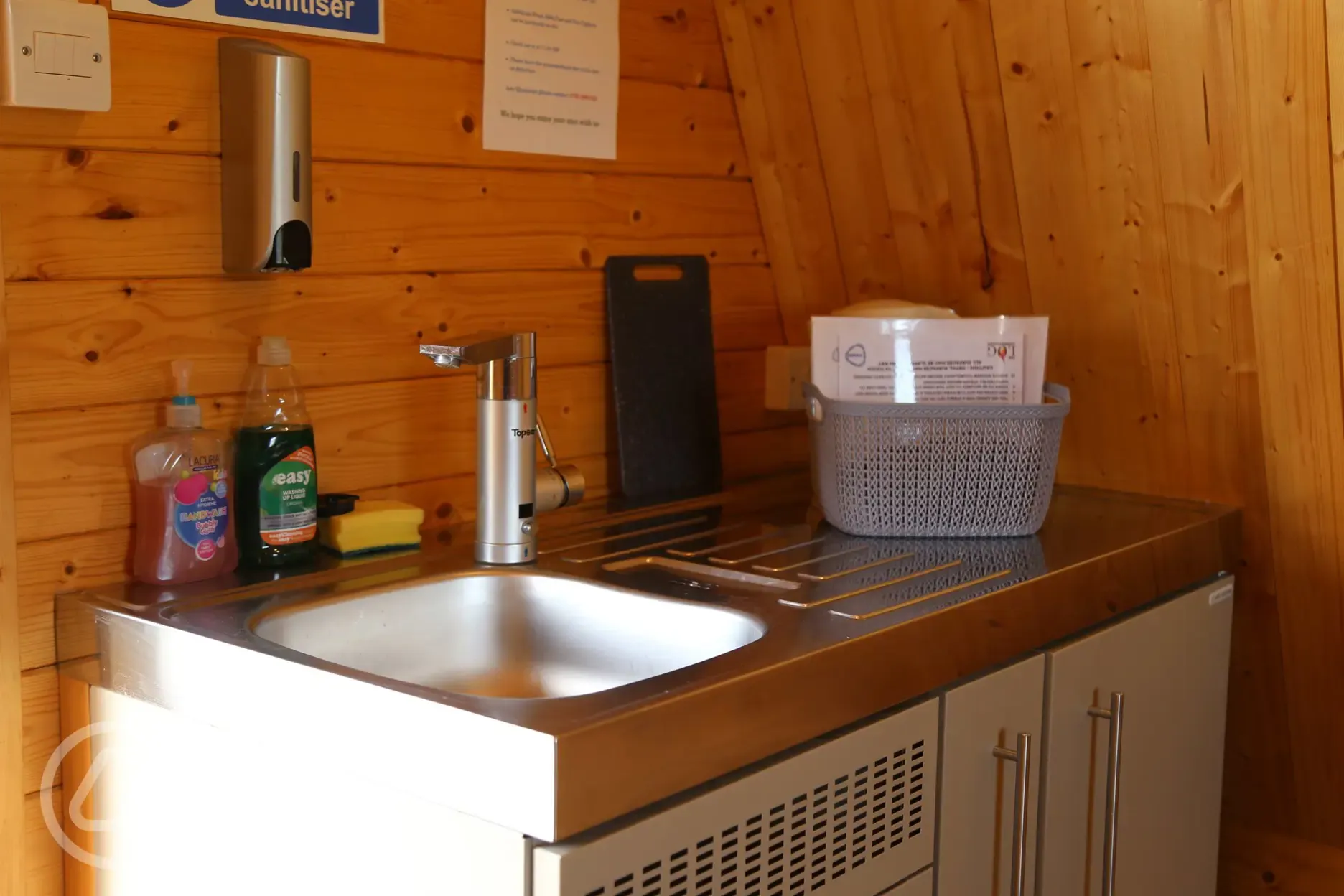 Glamping pod kitchen area with sink and washing up equipment
