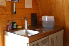 Glamping pod kitchen area with sink and washing up equipment Glamping pod kitchen area with sink and washing up equipment
