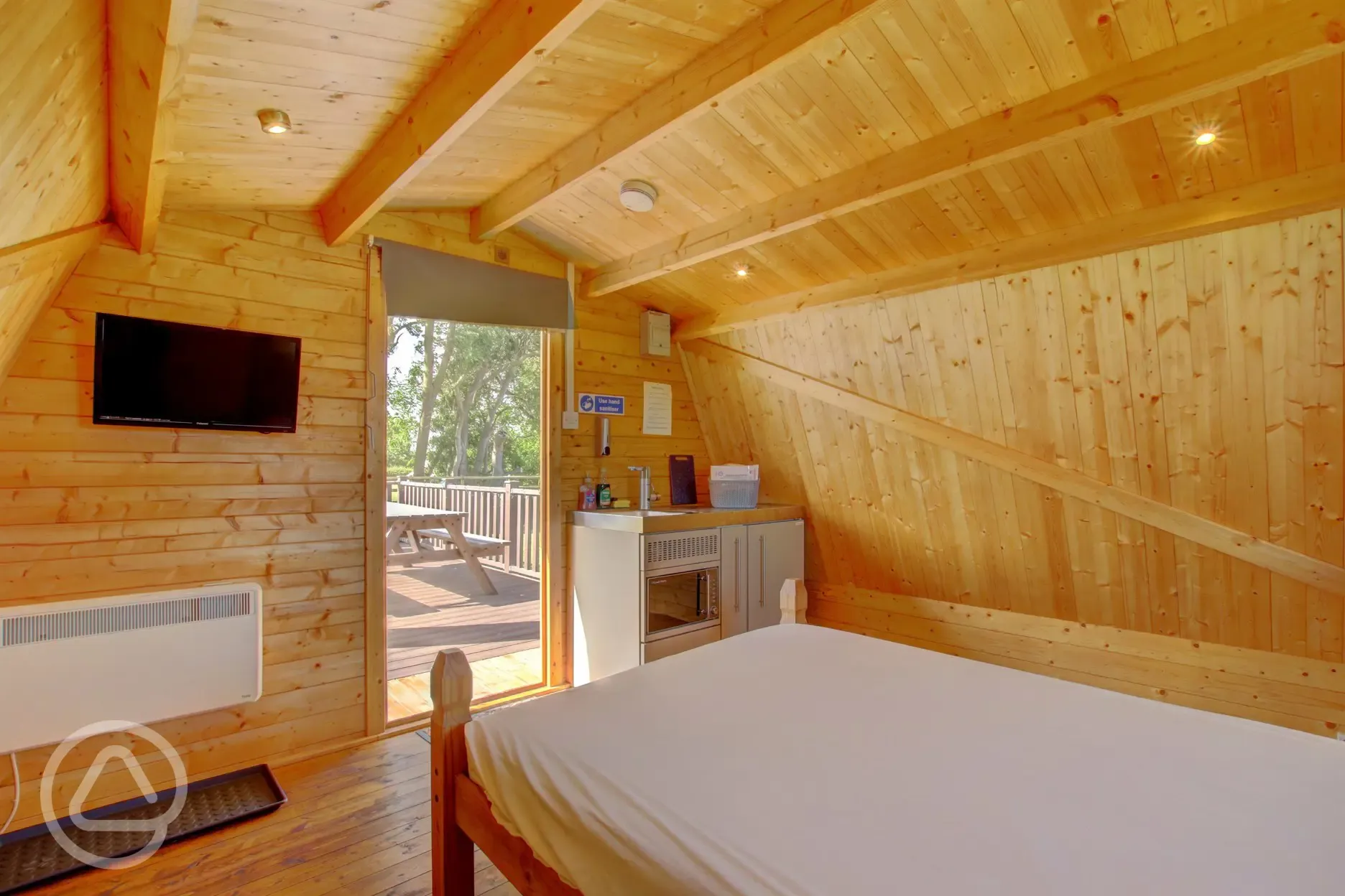 Plus glamping pod interior with a TV