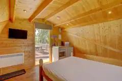 Plus glamping pod interior with a TV