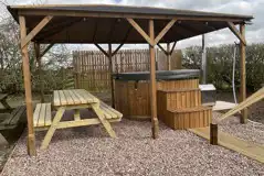 Plus deluxe Lotus Belle tent with square hot tub under gazebo