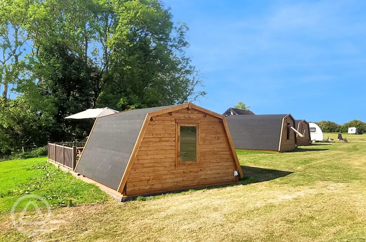 Plus glamping pod with hot tub and parasol on the large, private decking area
