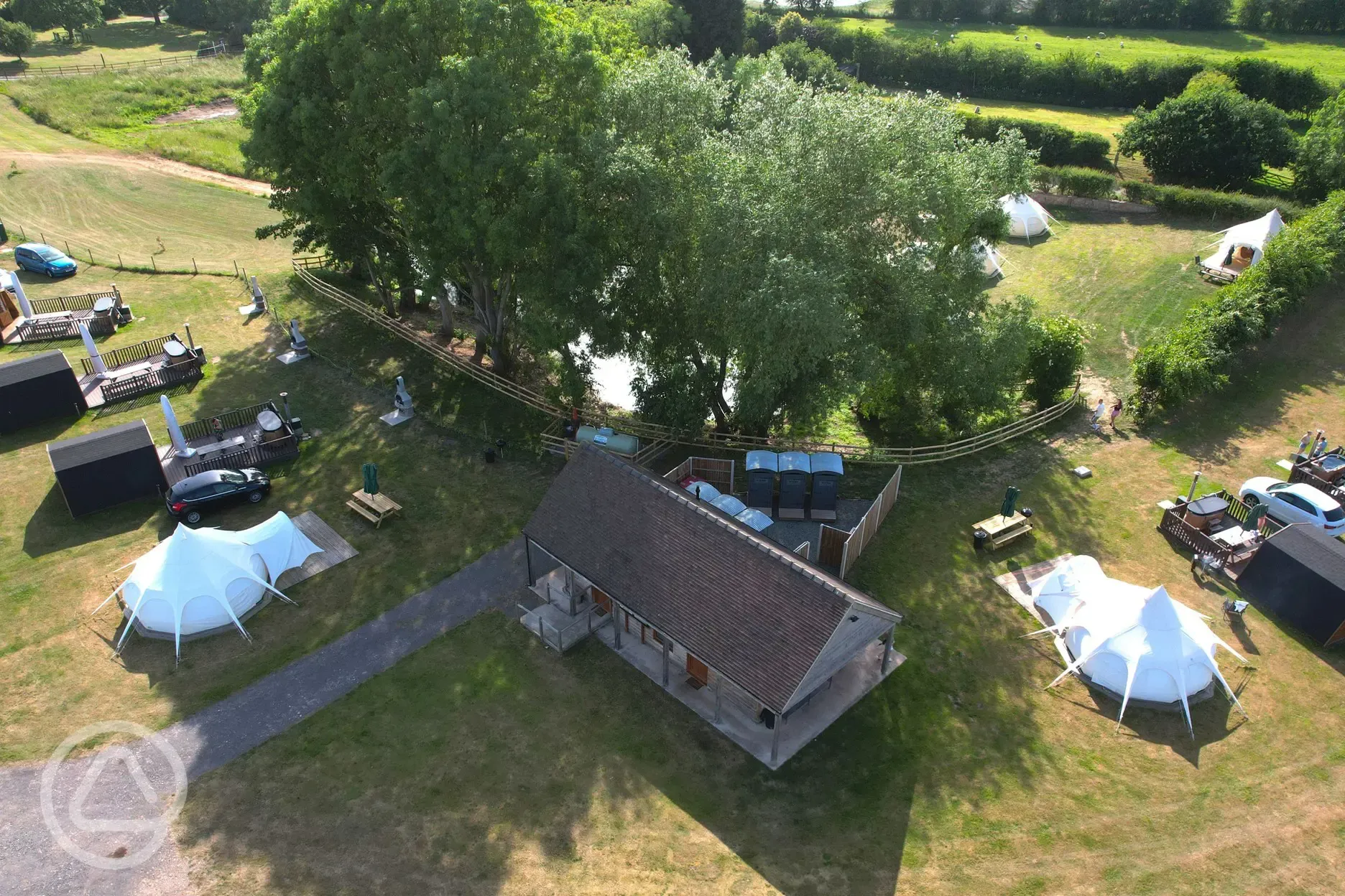 Aerial of the glamping area and facilities block at Hill Farm