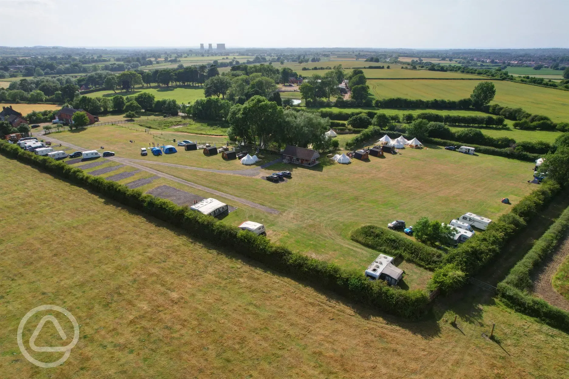 Aerial view of the camping, touring pitches and glamping area at Hill Farm