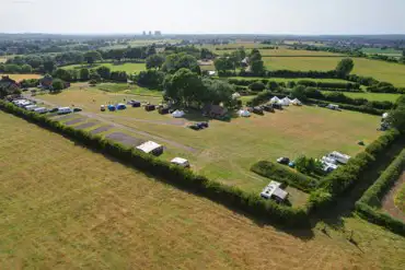 Aerial view of the camping, touring pitches and glamping area at Hill Farm