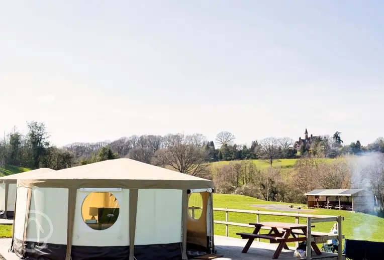 Glamping yurt with a raised deck and bench