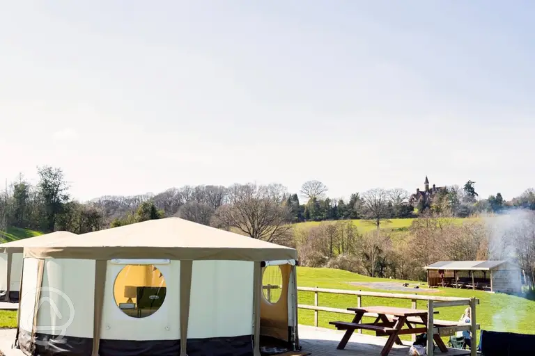 Glamping yurt with a raised deck and bench