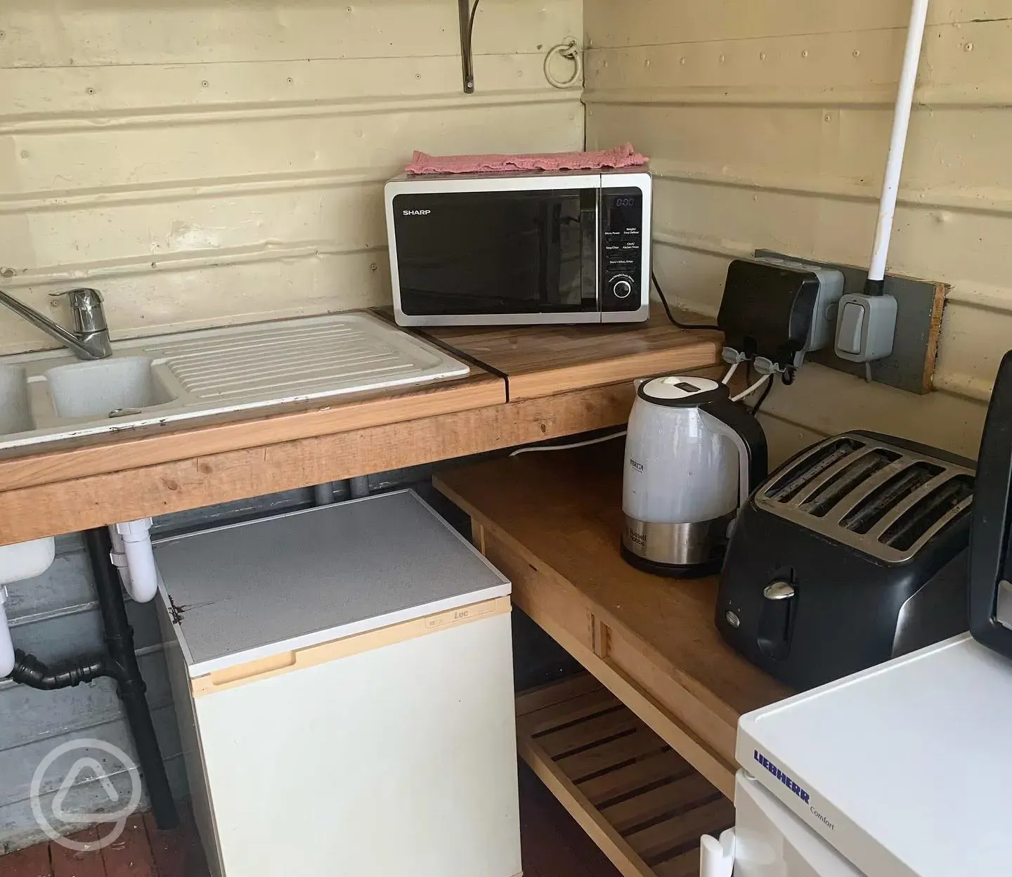 Shared kitchen with fridge, freezer, kettle and microwave 