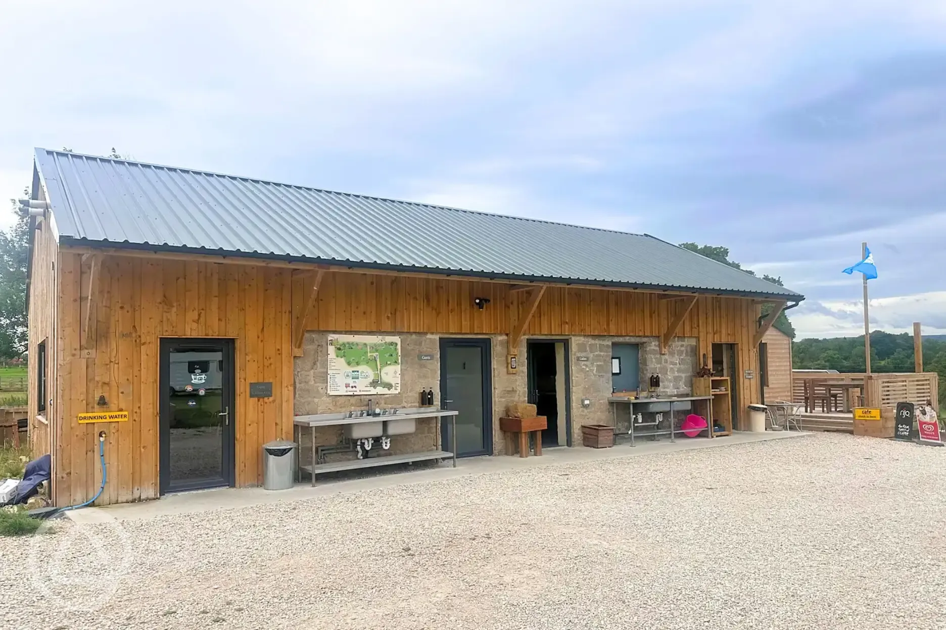 Facilities block with outdoor, covered washing up areas