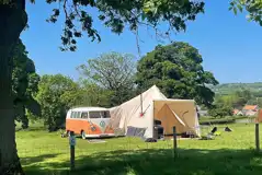 Non electric grass pitches with a campervan and bell tent awning Non electric grass pitches with a campervan and bell tent awning