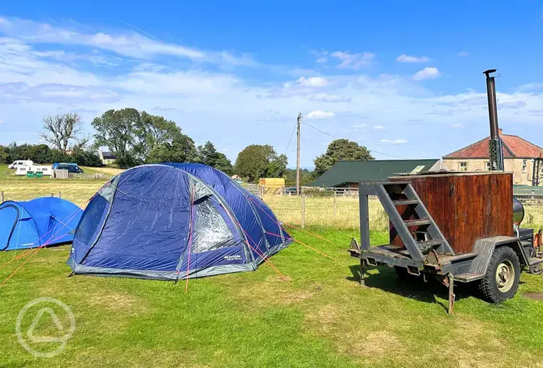 Non electric grass pitches (with wood-fired hot tubs to hire onsite)