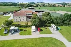 Aerial of the electric hardstanding pitches with grass areas