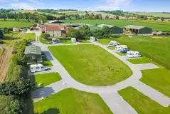 Aerial of Keld Knowle Farm Holidays surrounded by farmland