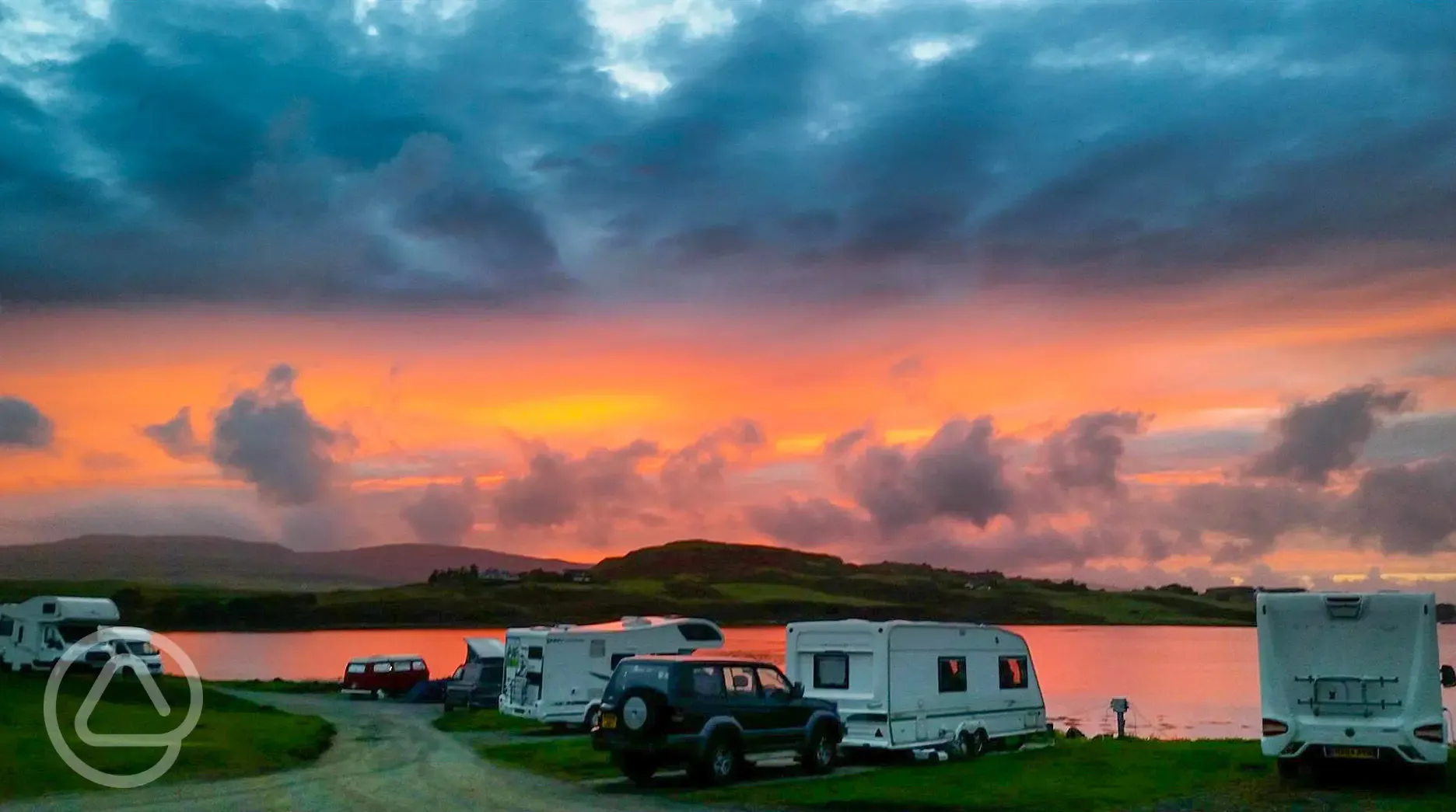Sunset around caravans at Kinloch Campsite
