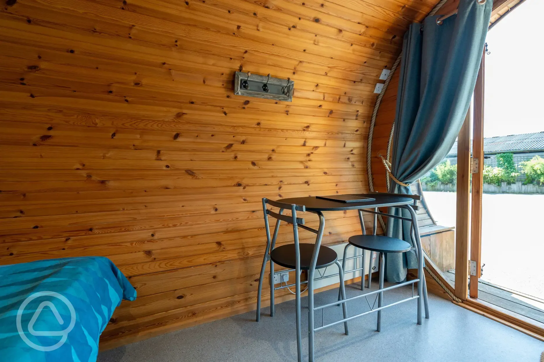 Glamping pod (adult only) dining area with table and two chairs