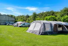 Electric grass pitches (family friendly) with a large tent Electric grass pitches (family friendly) with a large tent