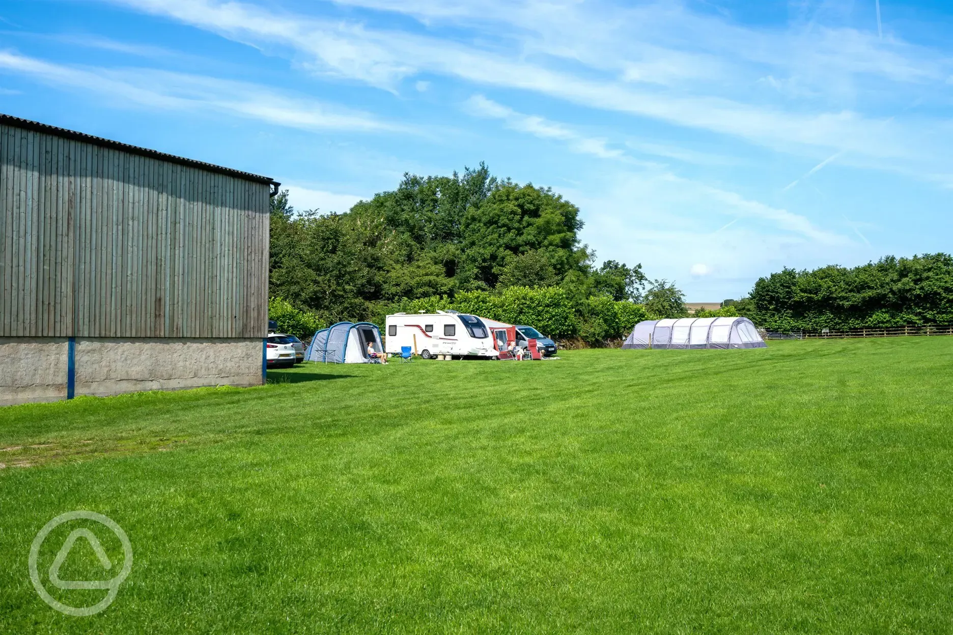 Electric grass pitches (family friendly) next to the facilities