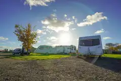 Serviced touring pitches with access to electric and fresh water Serviced touring pitches with access to electric and fresh water