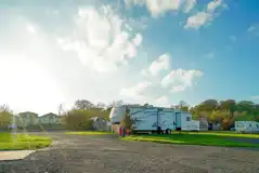 Serviced touring pitches with access to electric and fresh water Serviced touring pitches with access to electric and fresh water