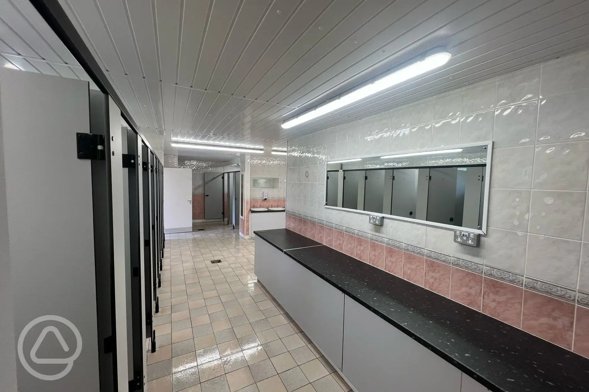 Ladies toilet block with mirrors and hand washing sinks