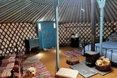 Yurt interior, fully furnished with a wood burner Yurt interior, fully furnished with a wood burner