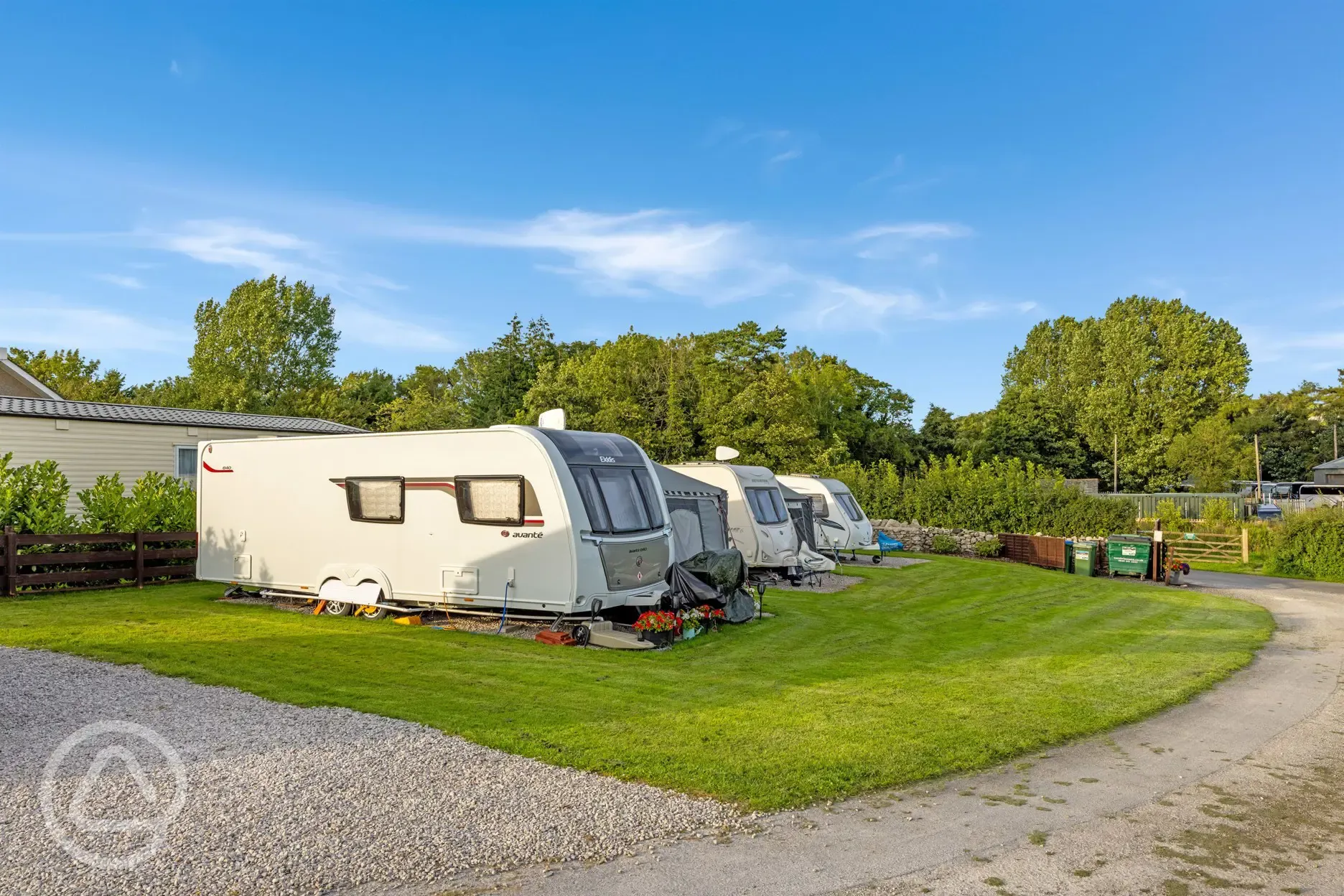 Electric hardstanding touring pitches with grass areas between