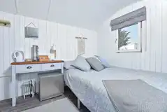 Large pods with a double bed, and a single trundle bed that turns into a king Large pods with a double bed, and a single trundle bed that turns into a king