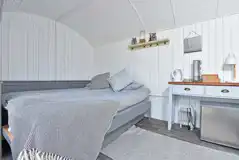 Large pods with a double bed, and a single trundle bed that turns into a king Large pods with a double bed, and a single trundle bed that turns into a king