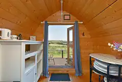 Sweet Pea camping pod interior with a kettle Sweet Pea camping pod interior with a kettle